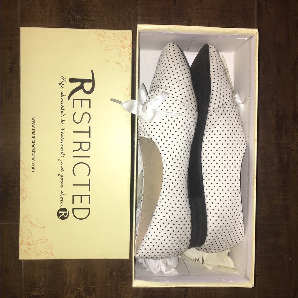 Restricted white polka dot lace ups